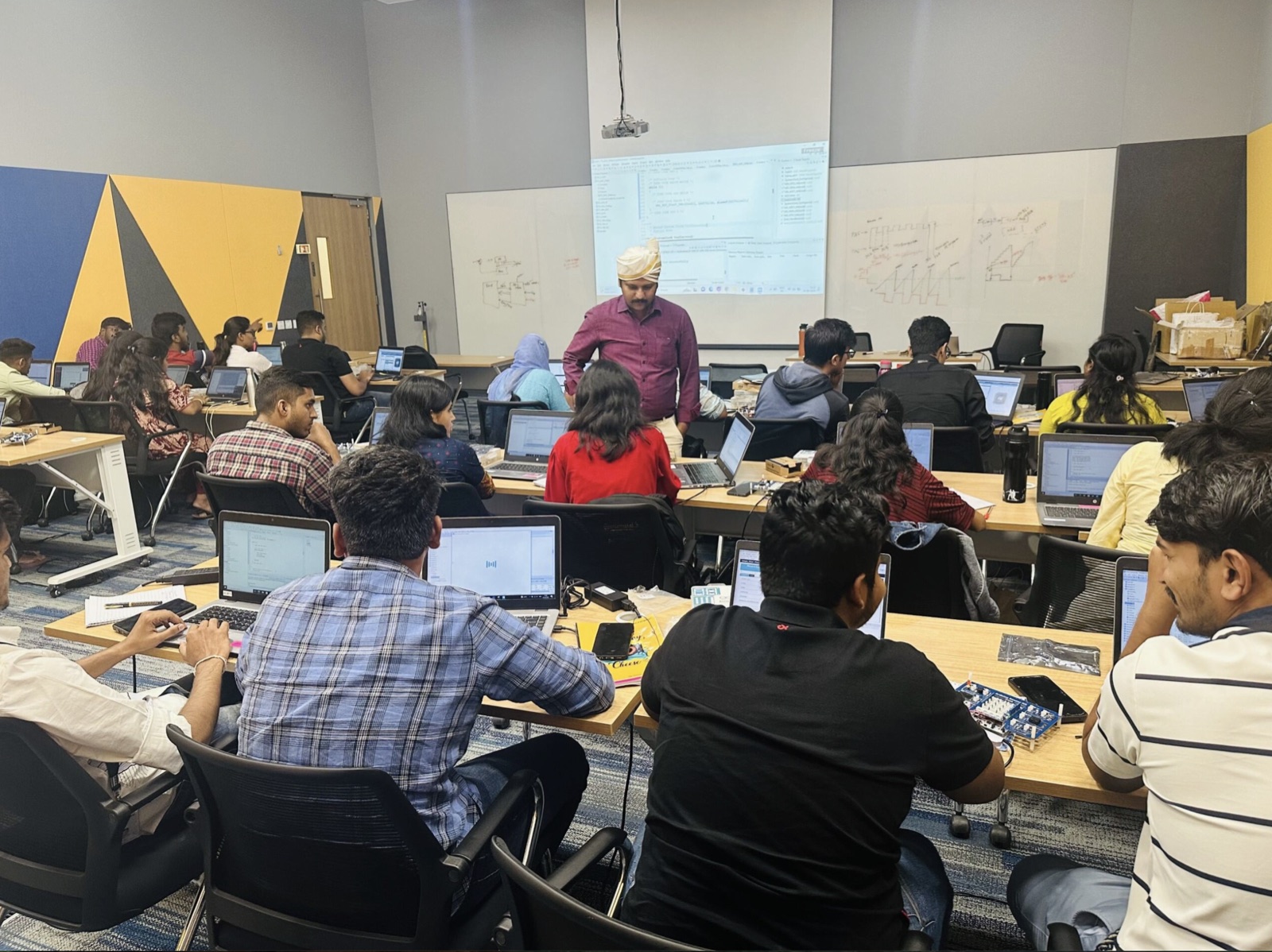 Smart-device engineers attending a firmware development training